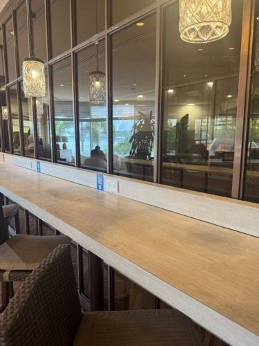 Counter seats at Caffè Cino designed for solo work with outlets