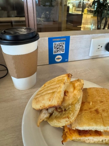 Large hot Americano and chicken panini at Caffè Cino