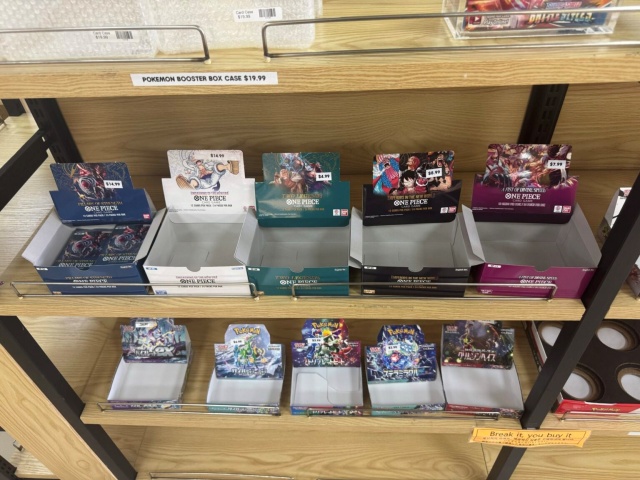 Most shelves were empty, with only a few Pokémon card products left near the register.