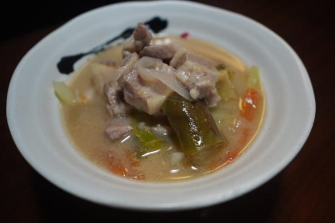 Sinigang na baboy with a spoonful of chili oil