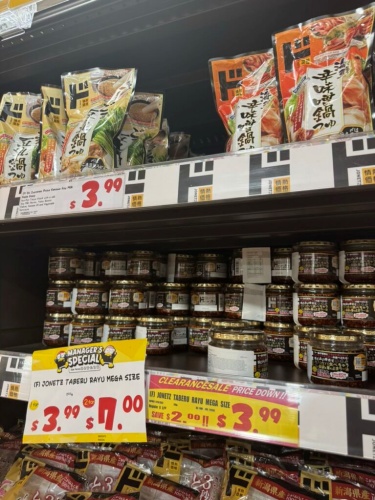 Close-up of the exact shelf where the chili oil is stocked