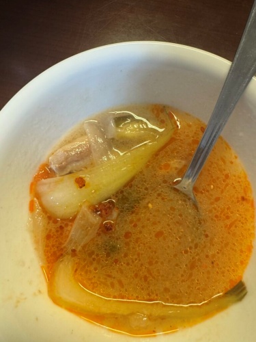Sinigang with chili oil — side angle