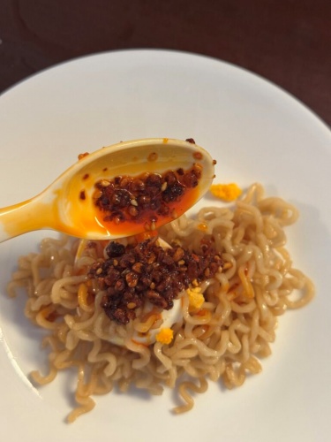 Crispy garlic pieces in the chili oil add texture to noodles