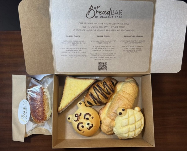 Six kinds of bread from Bread Bar by Okayama Kobo in a takeaway box